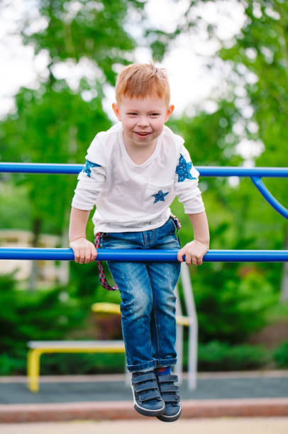 istock Little boy playing on the playground outdoors. 1269659792
