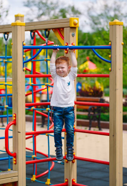 istock Little boy playing on the playground outdoors. 1269659853