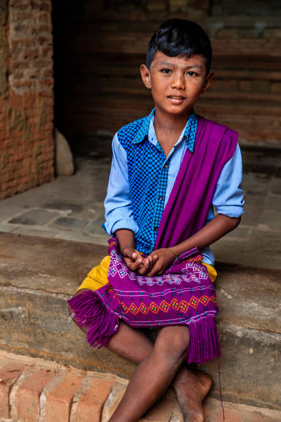 istock Young Burmese boy sitting in temple, Old Bagan, Myanmar 1269660050