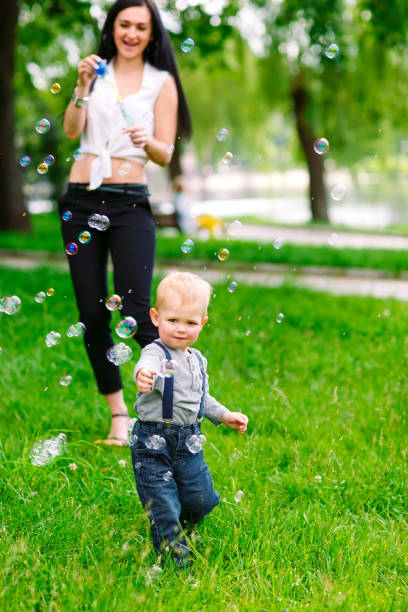 istock Mom and son are playing with soap bubbles. 1269661013