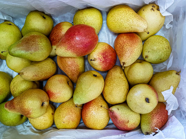 istock Fresh pears are in a drawer in the store. 1269661410