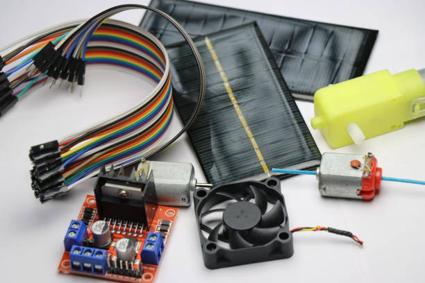 istock Electronic componets kit having solar panels,dual shaft dc motor,dc toy motor,dc gear motor,double shaft motor,motor controller,pc fan,switch and jumper wires on white background 1269665566