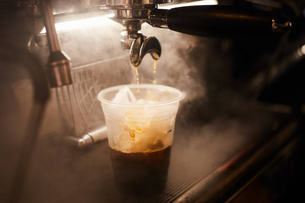 istock hot espresso into glass with ice 1269667633