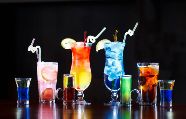 istock cocktails on bar counter on black background 1269667721