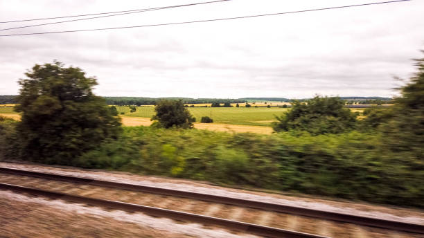 Train Travel Passenger View A passenger view from a high speed train that runs up and down the United Kingdom. window seat vehicle stock pictures, royalty-free photos & images