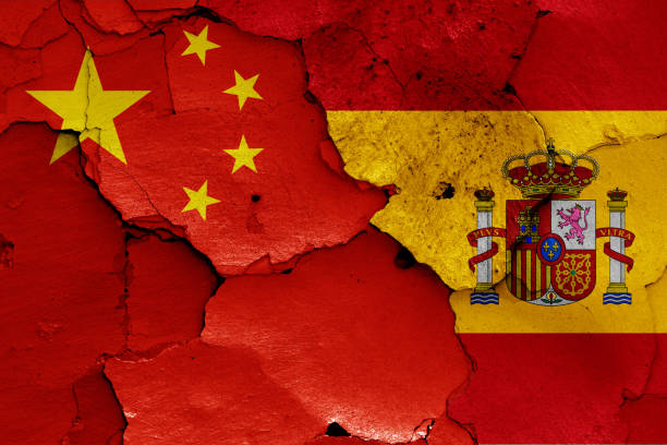 istock flags of China and Spain painted on cracked wall 1269670610