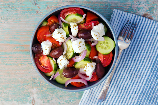 a top view of a traditional greek salad in a bowl