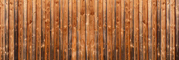 istock Panorama of a brown rustic wooden wall with intense grain 1269671569