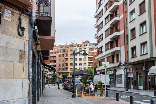 Bilbao, Biscay, Spain – August 21, 2020: People eating outside of restaurant in Bilbao