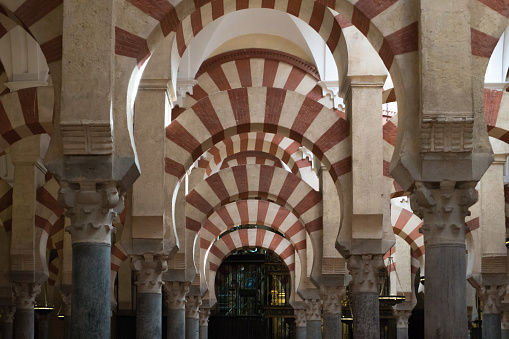 Cordoba,Spain-august 11, 2017:people admire the columns inside the beautiful Mezquita of Cordoba