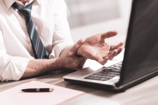 istock Businessman suffering from wrist pain 1269676654