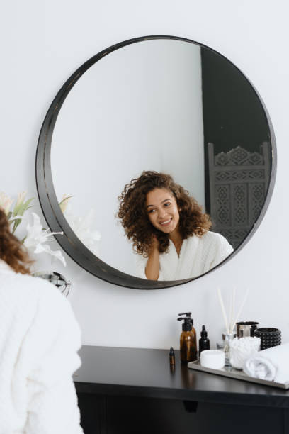 istock Afro american woman in bathrobe at bathroom 1269676872