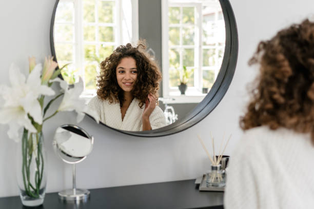istock African american woman in bathrobe at bathroom 1269676896