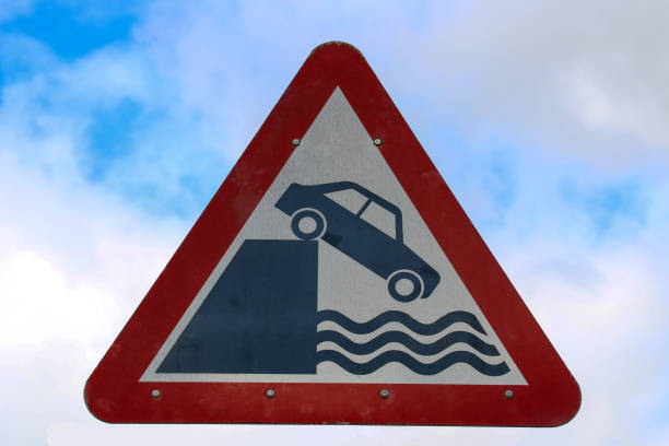 istock Old Danger Driving Sign at a Coastal Harbour Wall 1269678138