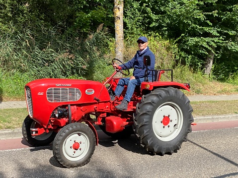Brunssum, the Netherlands, - August 30, 2020. Vintage tractors moving on during a cultural festival In the country.