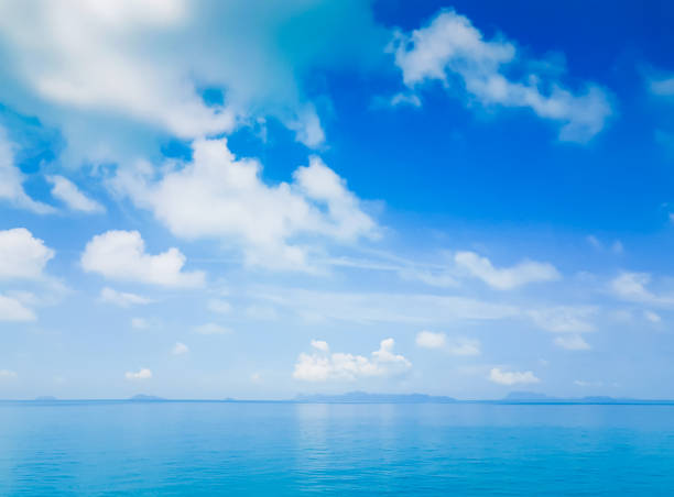 istock Blue sky with white cloud over turquise sea. 1269679651