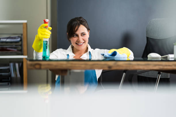 istock Janitor Cleaning Office Desk 1269681589