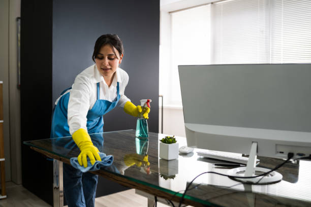 istock Janitor Cleaning Office Desk 1269681681