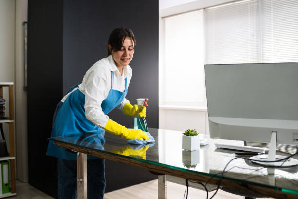 istock Janitor Cleaning Office Desk 1269681687