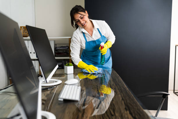istock Janitor Cleaning Office Desk 1269681719