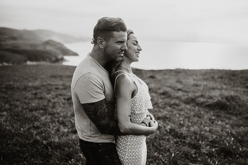 Portrait of a young couple by the sea