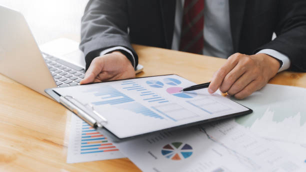 istock Financial inspector calculating a numbers in office room. 1269684006