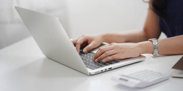istock Young woman using laptop studying online learning at home. 1269684060