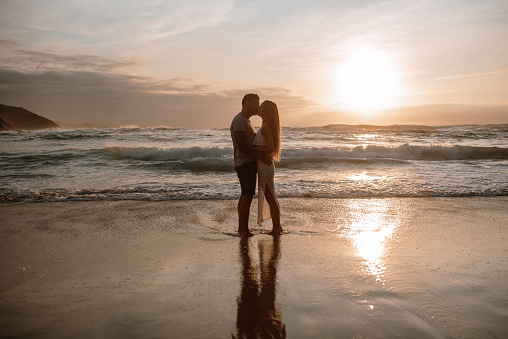 Portrait of a young couple embraced at sunset