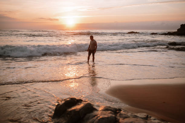 istock Portrait of a young man at a beach 1269684979