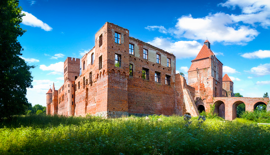 Szymbark, Poland - August 16,2020:Panoramic view of fourteenth-century castle in the village of Szymbark built by the Pomesanian chapter. It was burnt down in 1946 by the Red Army and has been in ruins ever since.