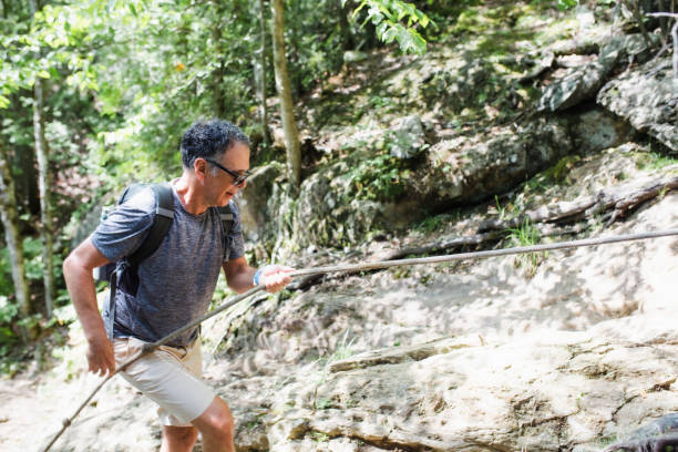 istock Portrait of a mature climbing a mountain 1269686328