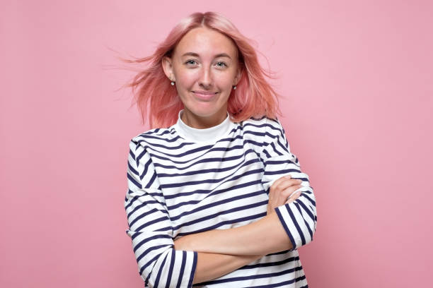 istock Beautiful woman looking happily at camera 1269687096