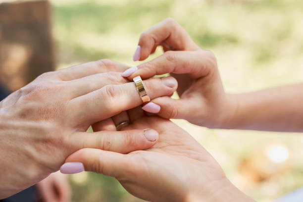 istock Wedding couple exchanging wedding rings. Wedding rings. 1269687591