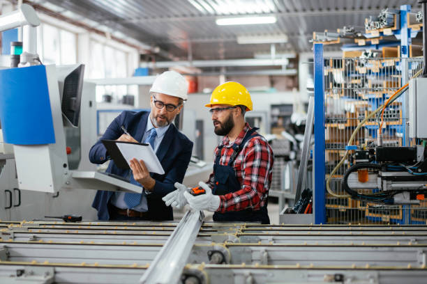 istock Quality inspector and manual worker in a factory 1269689060