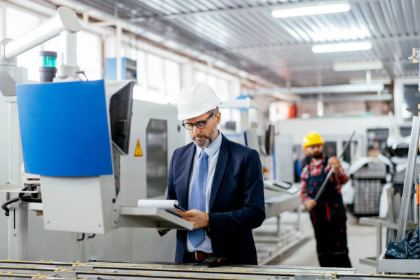 istock Quality inspector and manual worker in a factory 1269689076