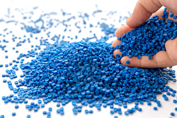 istock Blue plastic grain, plastic polymer granules,hand hold Polymer pellets, Raw materials for making water pipes, Plastics from petrochemicals and compound extrusion, resin from plant polyethylene. 1269691084