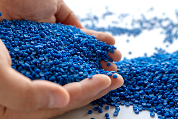 istock Blue plastic grain, plastic polymer granules,hand hold Polymer pellets, Raw materials for making water pipes, Plastics from petrochemicals and compound extrusion, resin from plant polyethylene. 1269691724