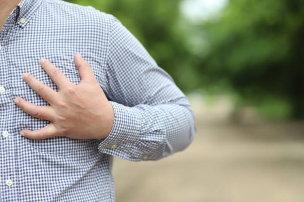 istock Image of a man holding onto his chest. 1269691831