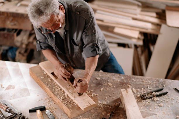 istock Mature carpenter at work stock photo 1269692674