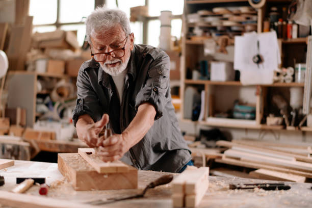istock Mature carpenter at work stock photo 1269692868