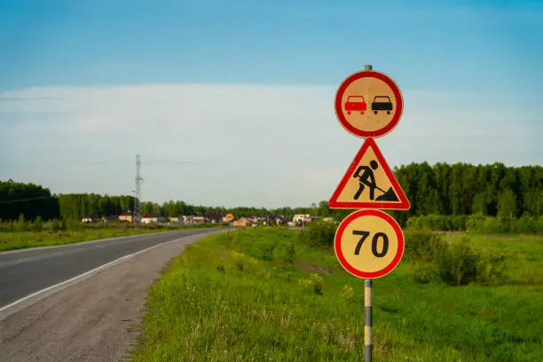 70 speed limit with road construction and overtaking forbidden road signs