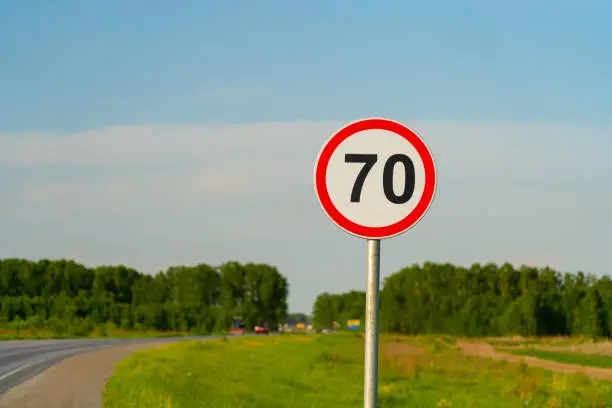 70 speed limit road sign on country road