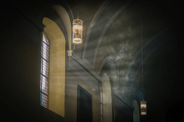 istock Mystical light. Smoke and sunlight in ancient church 1269694043