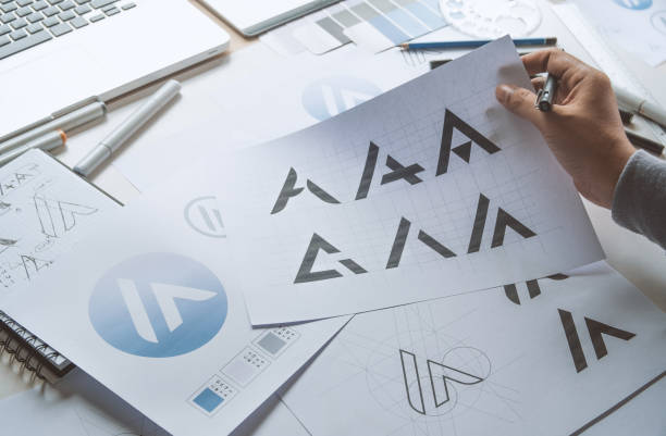 istock Graphic designer creative design sketch drawing logo Trademark brand Workspace 1269694264