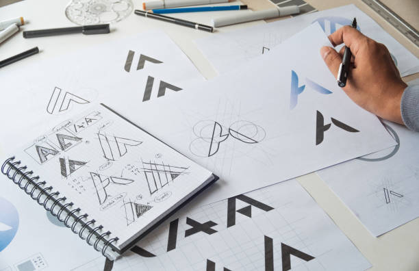 istock Graphic designer creative design sketch drawing logo Trademark brand Workspace 1269694265