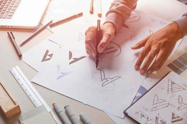 istock Graphic designer creative design sketch drawing logo Trademark brand Workspace 1269694267