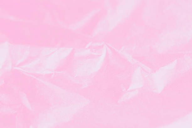 istock Crumpled pink with light shadows paper texture abstract background 1269695327