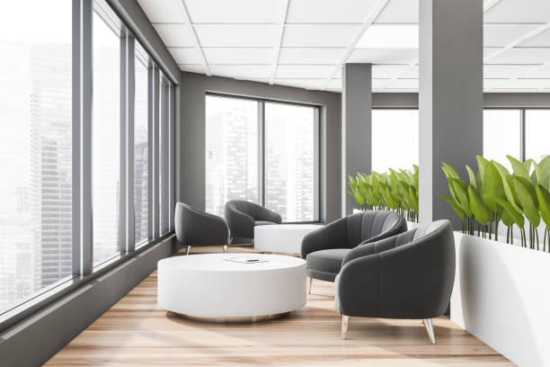 istock Gray office waiting room with armchairs 1269696121