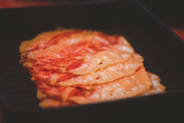 istock Beef raw slice on black tray for hot pot or grill (barbecue or yakiniku). 1269696272