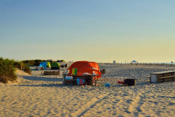 Assateague Dune Tent Campsite An Assateague Island National Seashore tent camping on the sand dunes adjacent to the beach on a nice late August morning with foodstuffs and trash in evidence eastern shore sand sand dune beach stock pictures, royalty-free photos & images